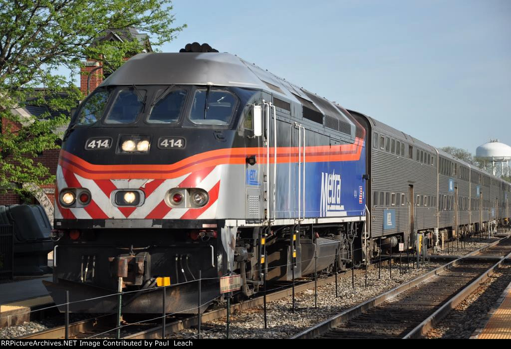 Outbound commuter approaches its station stop